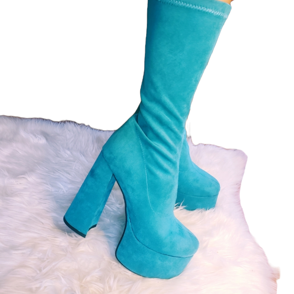 Teal blue suede retro chunky platform boots. Round toe and block heel give it a 60's and 70's inspired twist. Knee high suede boots.