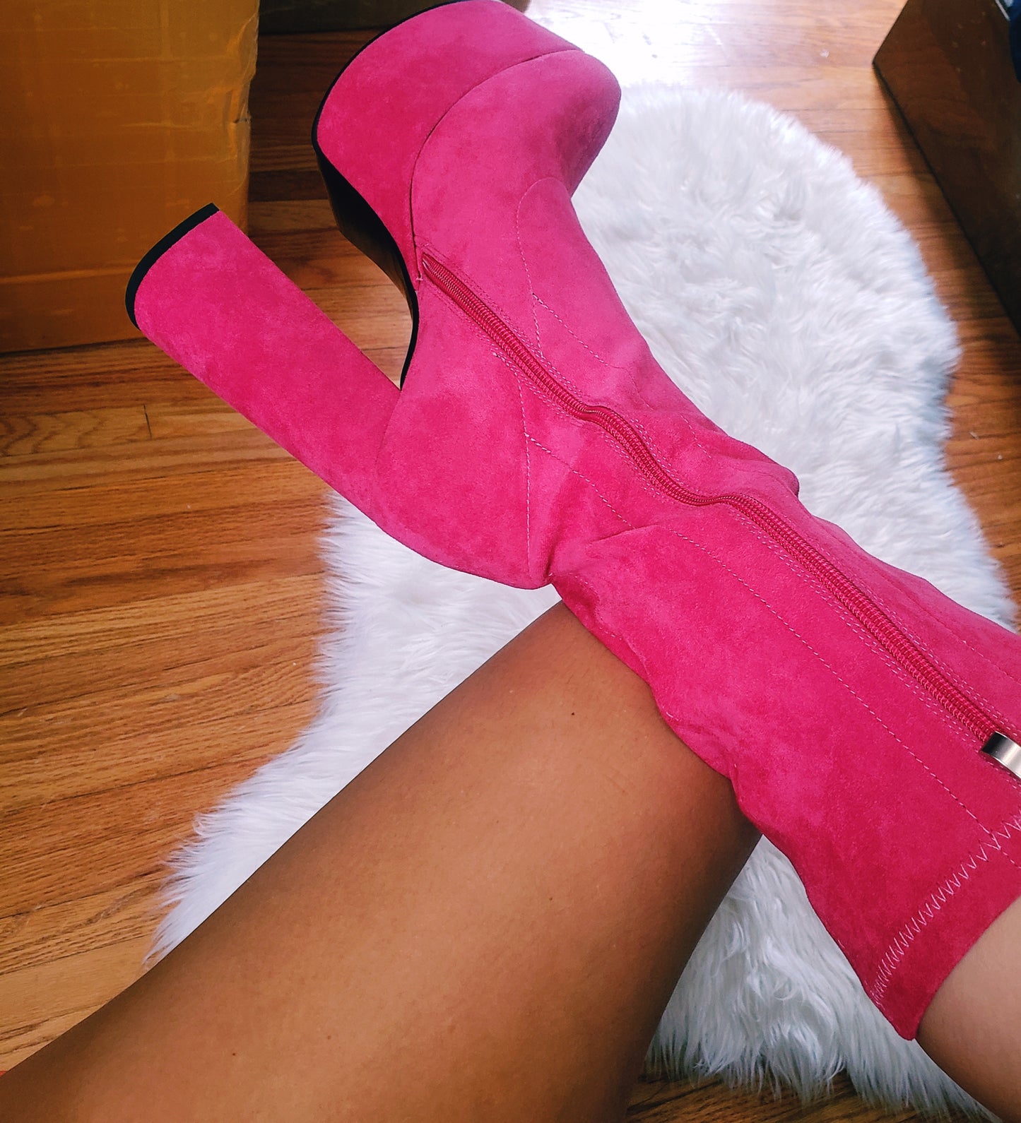 Pink suede retro chunky platform boots. Round toe and block heel give it a 60's and 70's inspired twist. Knee high suede boots.