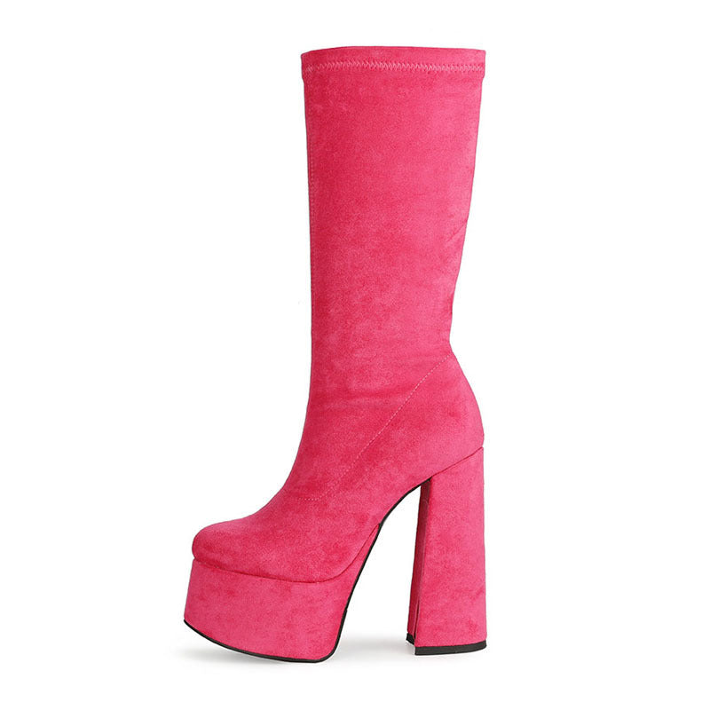 Pink suede retro chunky platform boots. Round toe and block heel give it a 60's and 70's inspired twist. Knee high suede boots.