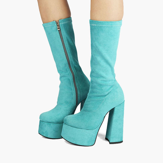 Teal blue suede retro chunky platform boots. Round toe and block heel give it a 60's and 70's inspired twist. Knee high suede boots.