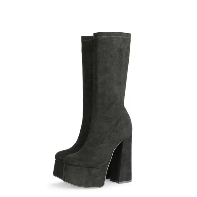 Black suede retro chunky platform boots. Round toe and block heel give it a 60's and 70's inspired twist. Knee high suede boots. 