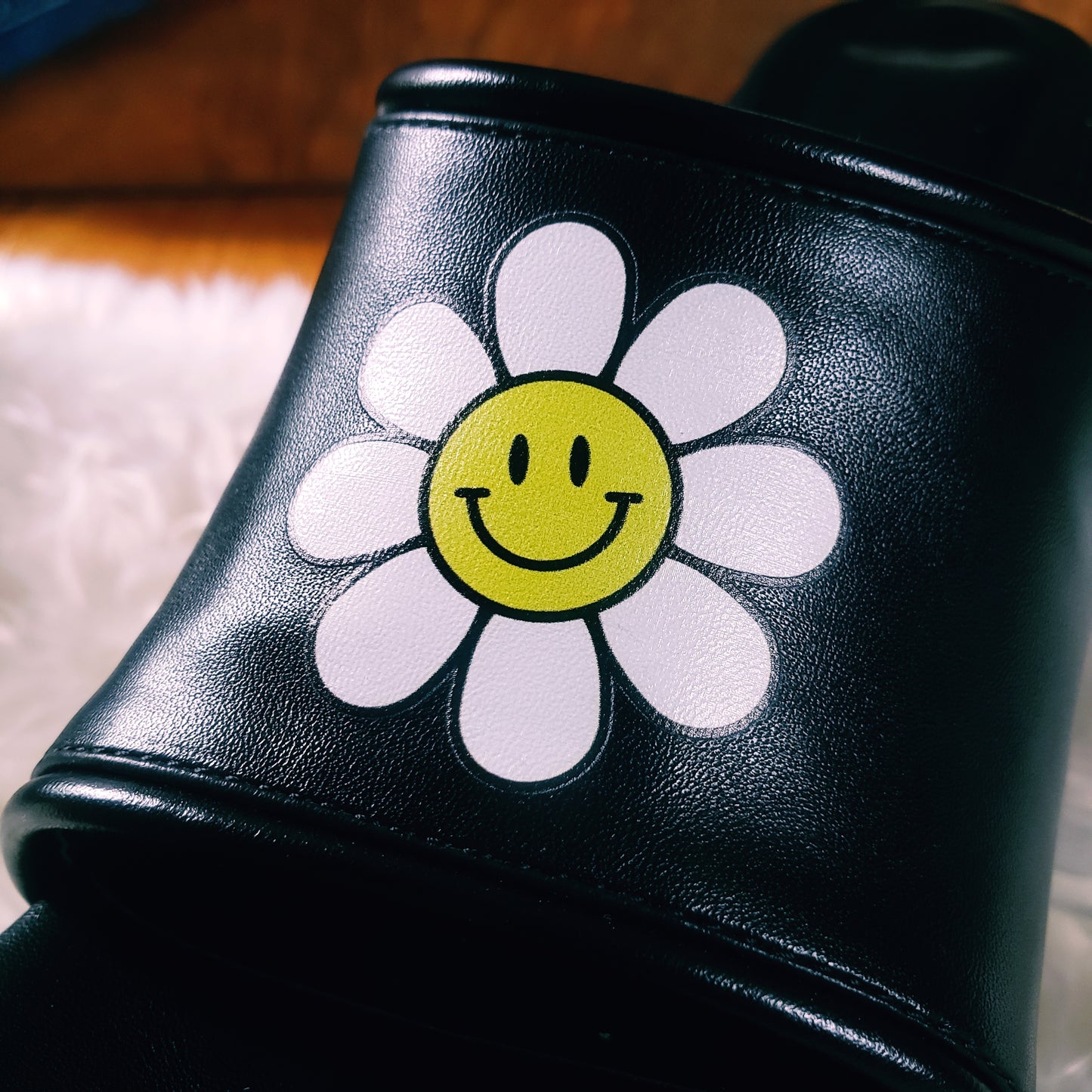 Black Platform Sandals with smiling daisy graphic on the front upper. Open toe flatform sandals. Chunky platform style, 90s and 70s inspired.