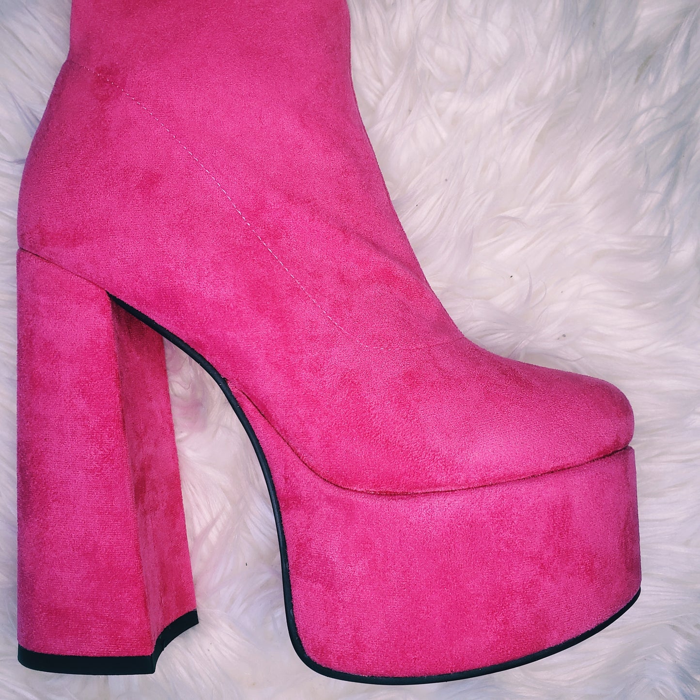 Pink suede retro chunky platform boots. Round toe and block heel give it a 60's and 70's inspired twist. Knee high suede boots.