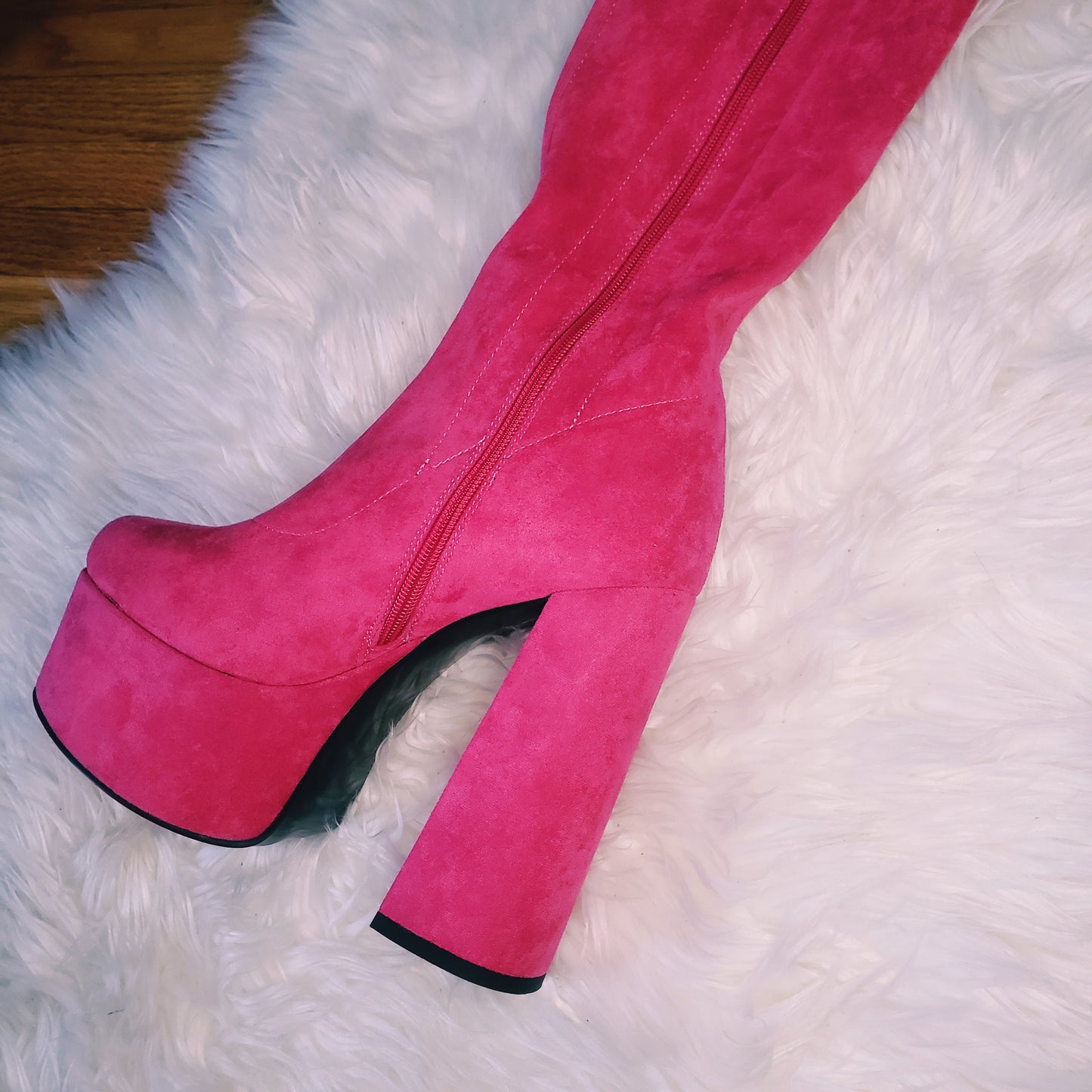 Pink suede retro chunky platform boots. Round toe and block heel give it a 60's and 70's inspired twist. Knee high suede boots.