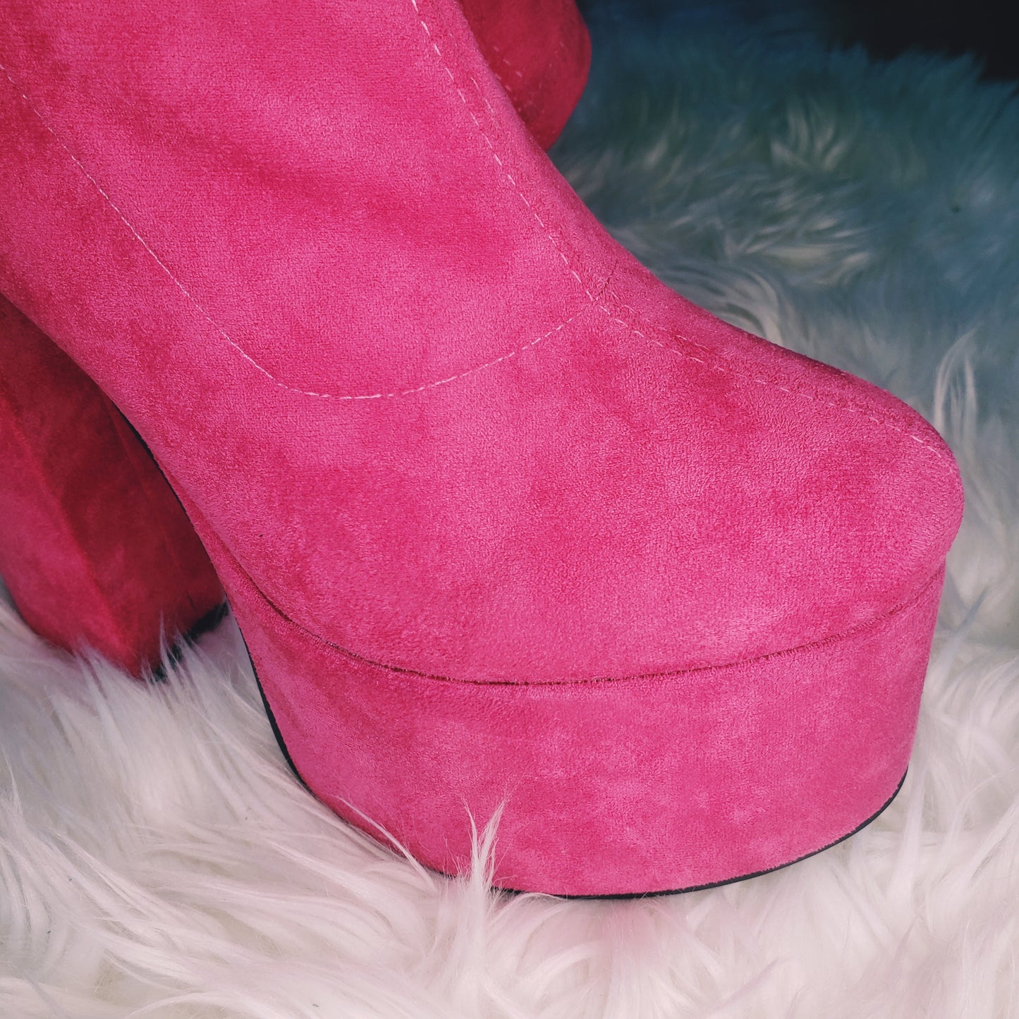 Pink suede retro chunky platform boots. Round toe and block heel give it a 60's and 70's inspired twist. Knee high suede boots.