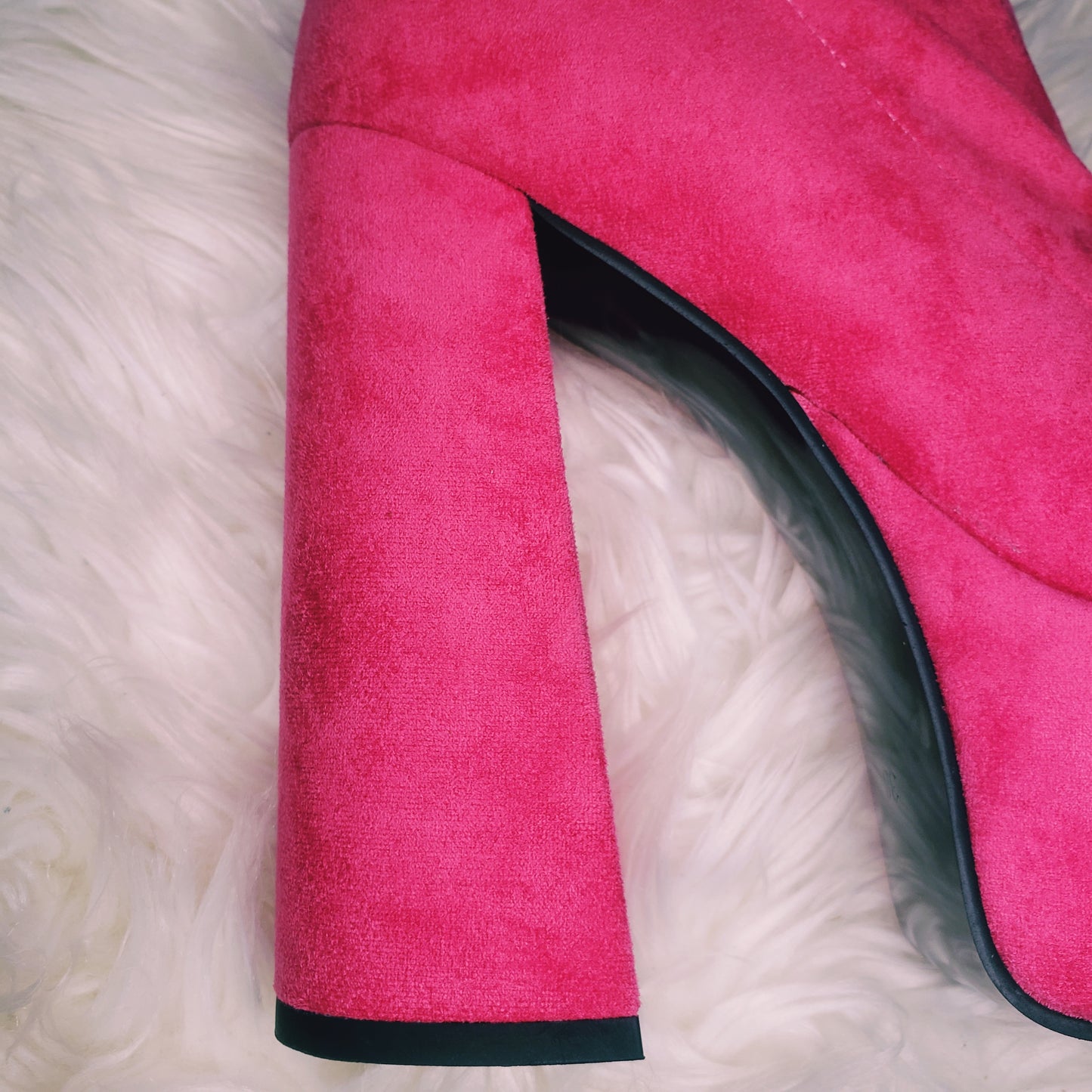 Pink suede retro chunky platform boots. Round toe and block heel give it a 60's and 70's inspired twist. Knee high suede boots.