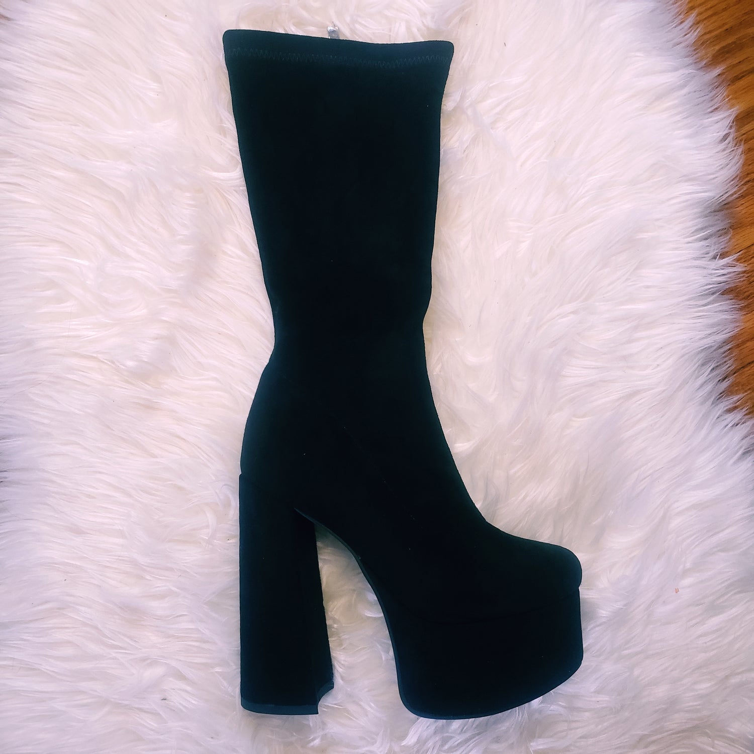 Black suede retro chunky platform boots. Round toe and block heel give it a 60's and 70's inspired twist. Knee high suede boots. 