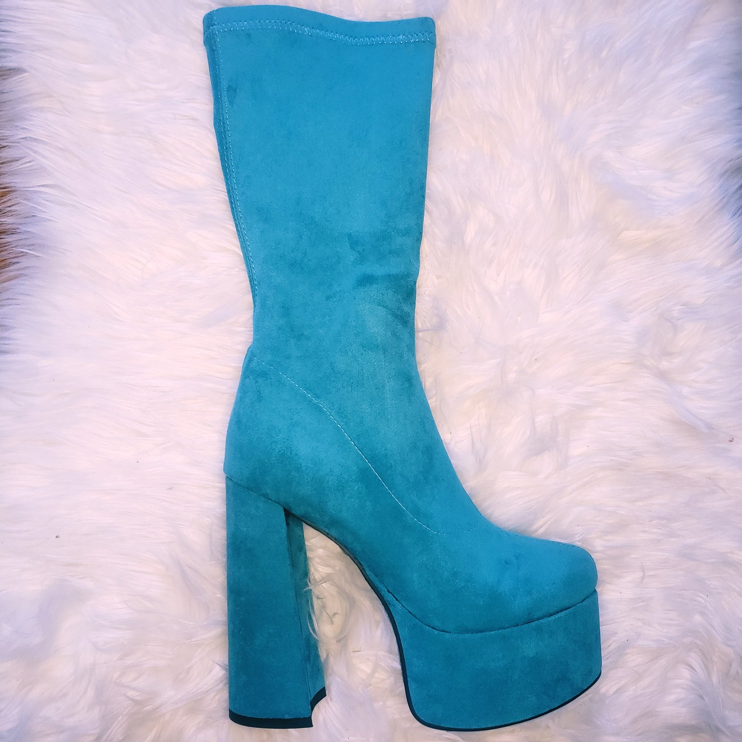 Teal blue suede retro chunky platform boots. Round toe and block heel give it a 60's and 70's inspired twist. Knee high suede boots.
