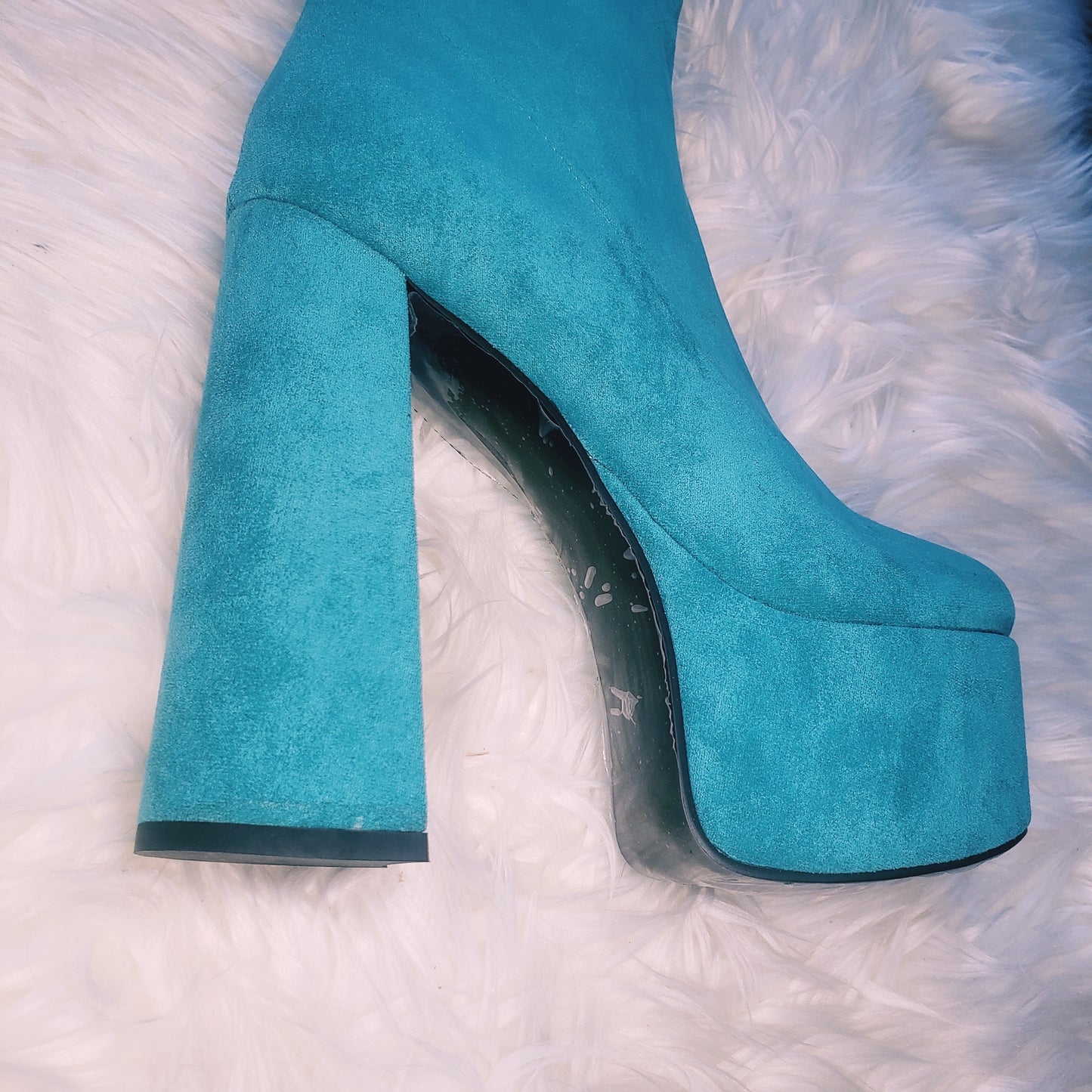 Teal blue suede retro chunky platform boots. Round toe and block heel give it a 60's and 70's inspired twist. Knee high suede boots.