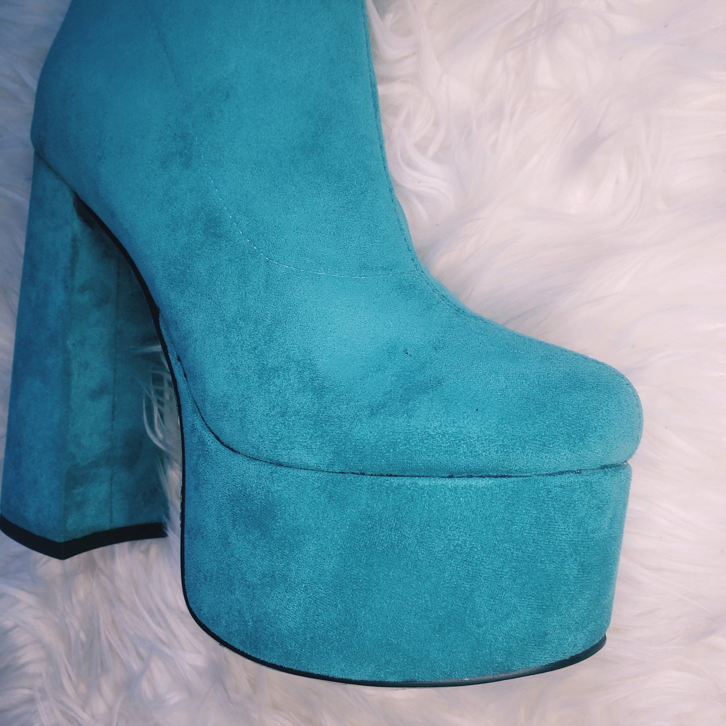 Teal blue suede retro chunky platform boots. Round toe and block heel give it a 60's and 70's inspired twist. Knee high suede boots.