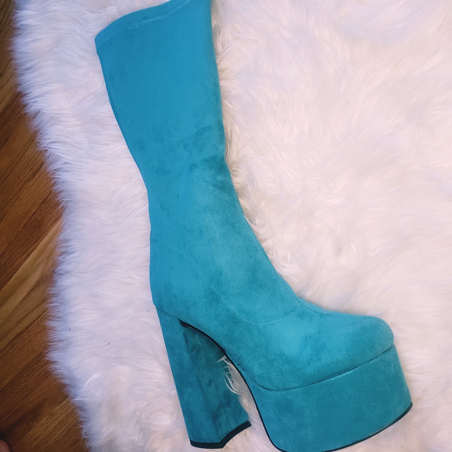 Teal blue suede retro chunky platform boots. Round toe and block heel give it a 60's and 70's inspired twist. Knee high suede boots.