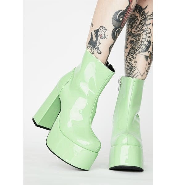 Glossy pastel green patent leather platform gogo boots. Ankle length with round toe and chunky block heel. Inspired by the 1960's gogo boots.